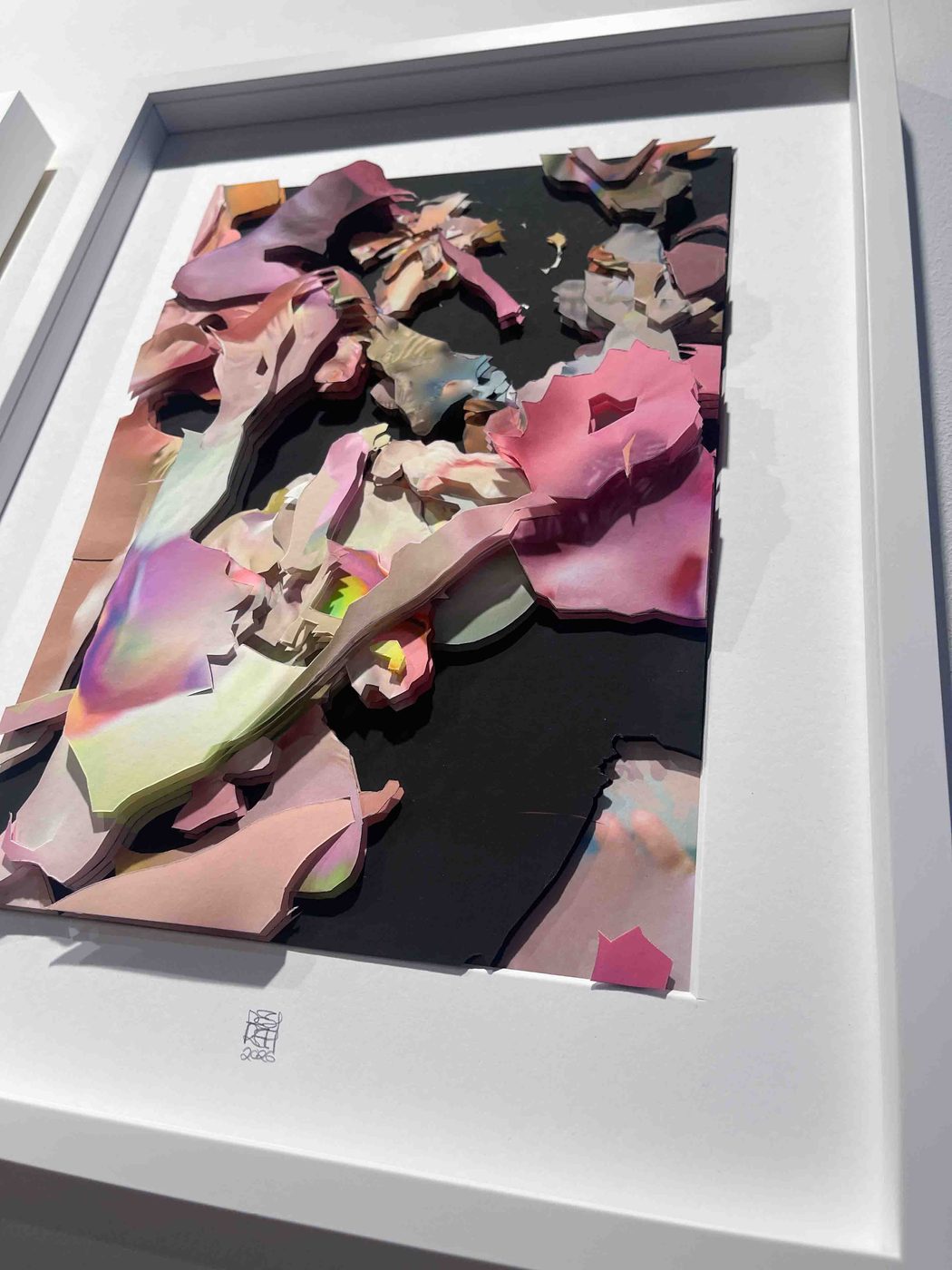 Unseen Worlds – layered paper collage on black ground, seen at an angle