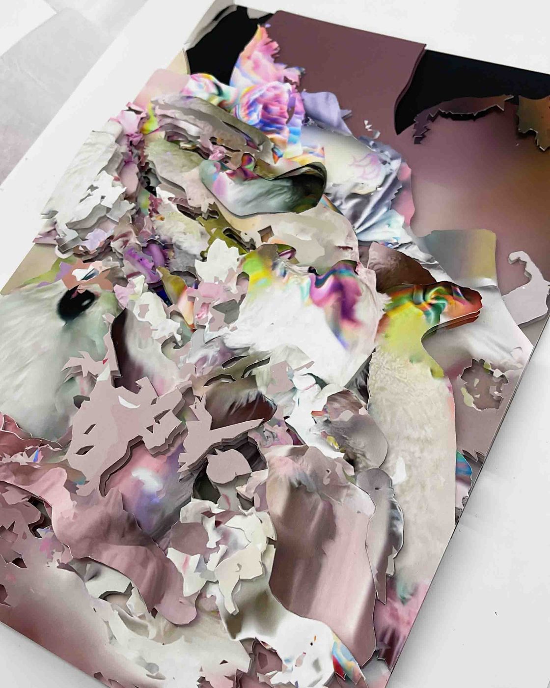 Unseen Worlds – layered paper collage in white and mauve, seen at an angle