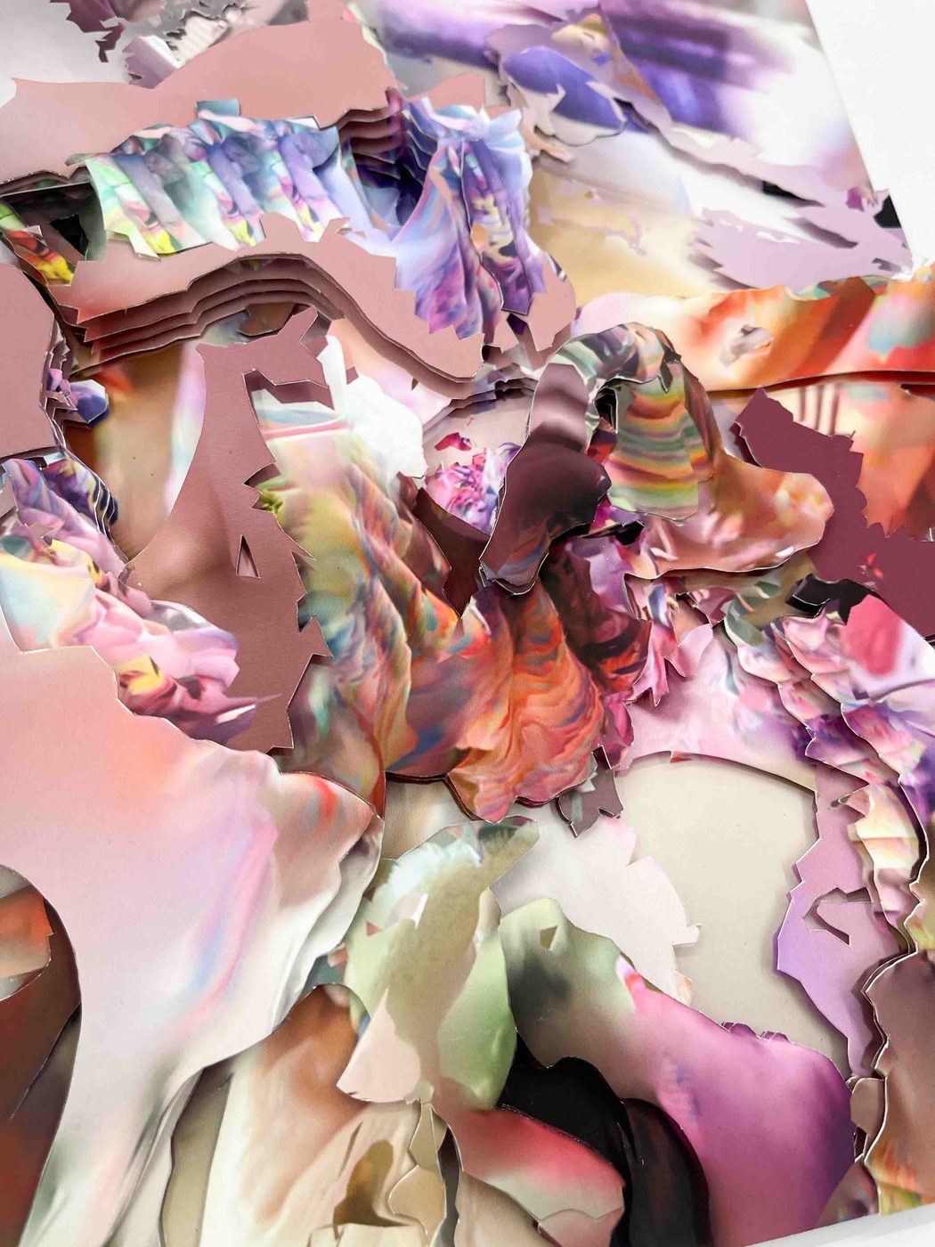 Unseen Worlds – detail of a layered paper collage in pink, orange and violet